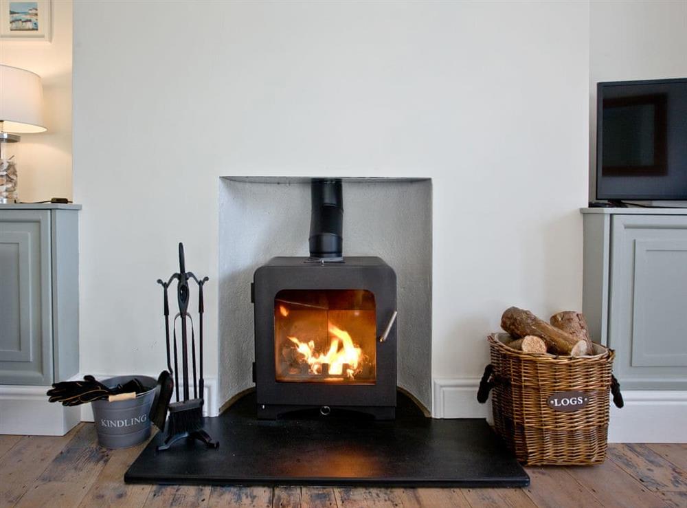 Warming wood burner at Happy Place in Brixham, Devon