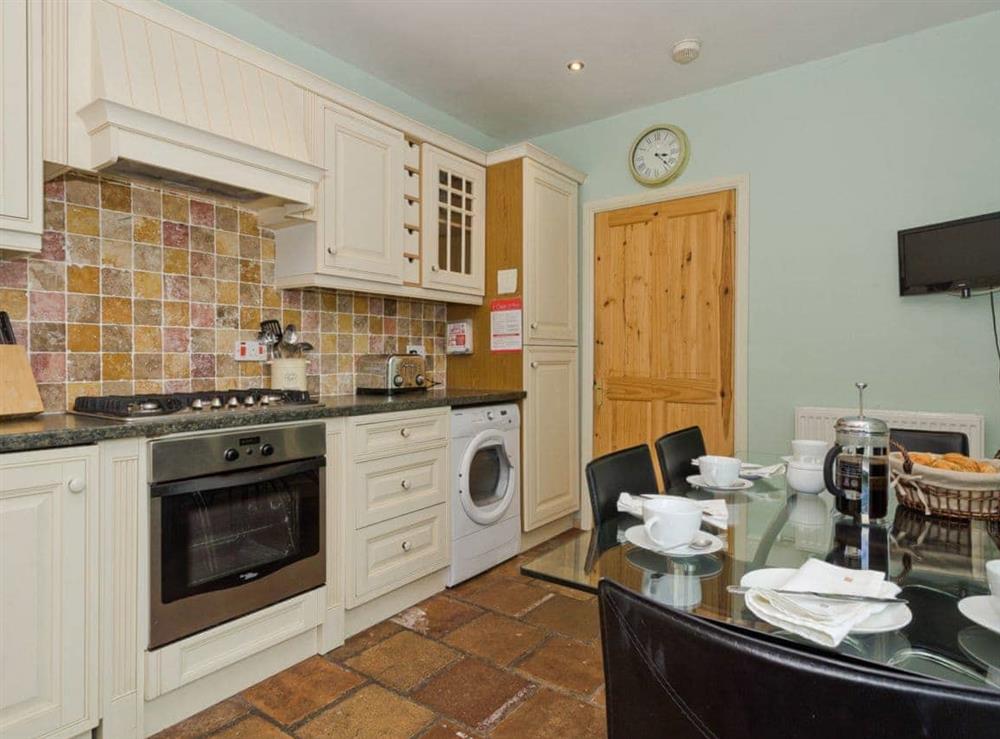 Kitchen with dining area at Harbour Cottage in Port William, Wigtownshire