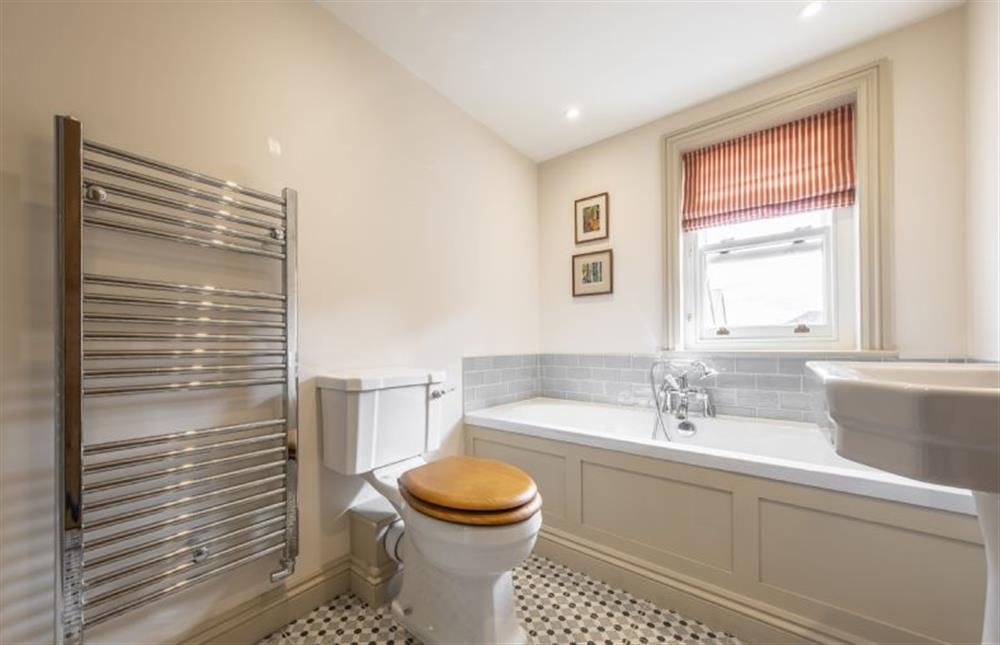 Bathroom with bath with handheld shower head at Harbour Cottage, Wells-next-the-Sea