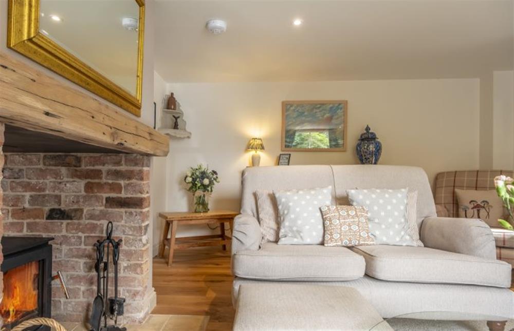 Take a seat beside the wood burning stove at Harbour Cottage, Wells-next-the-Sea