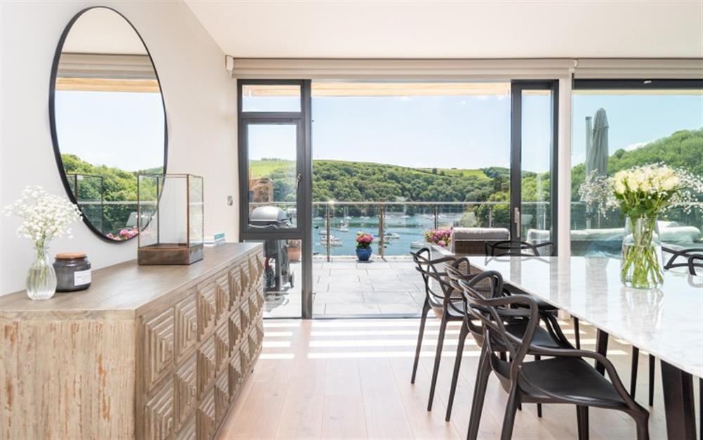 The dining area with panoramic views  at Harbour Edge in Newton Ferrers