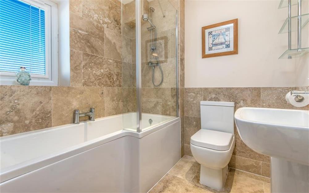 Family bathroom with shower over bath at Harbour Lights in Bridport