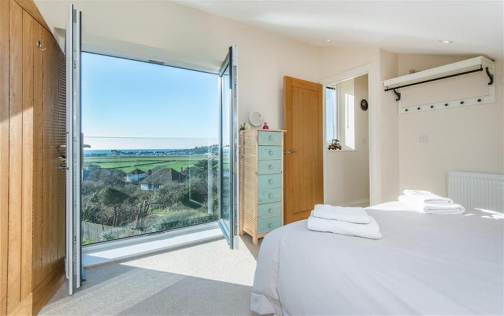 Juliette balcony in bedroom 5 provides a fantastic view to wake up to at Harbour Lights in Bridport