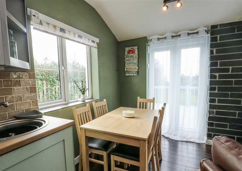 The dining area at Harbour Lights, Church Bay