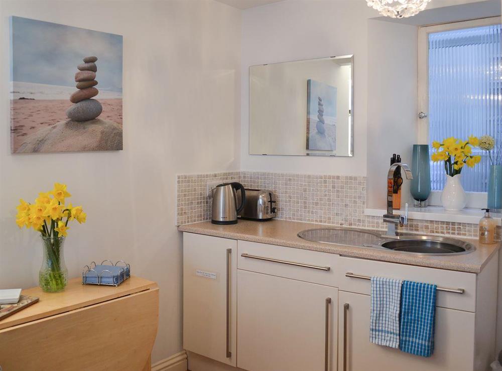 Modest dining/kitchen area at Harbour Lights in Newlyn, near Penzance, Cornwall