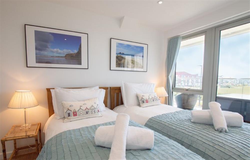 Bedroom two with doors onto the balcony at Harbour Lights, Newquay 