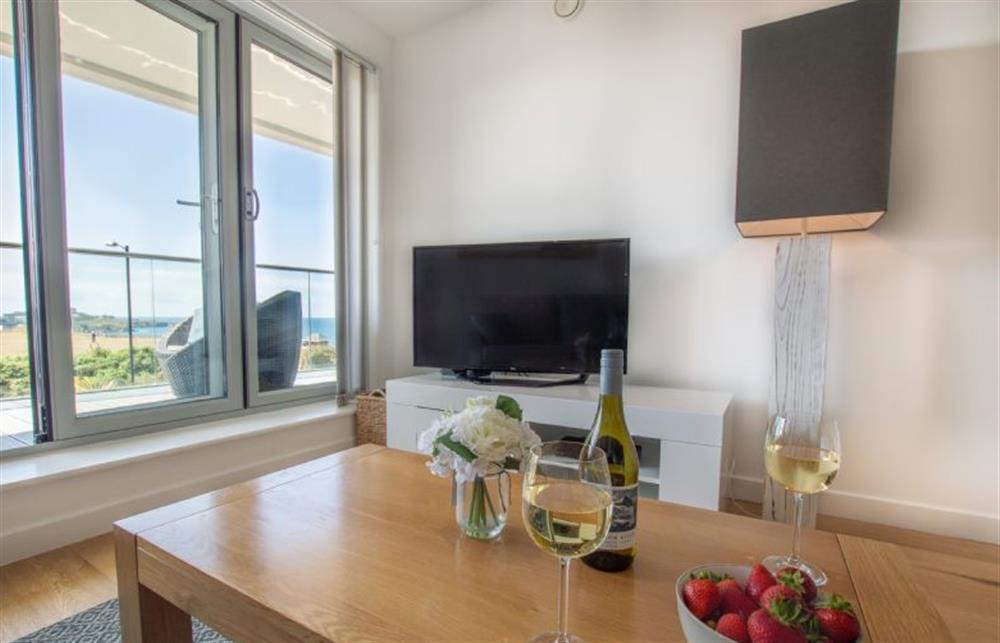 Grab a glass of wine and unwind for the evening in front of the spectacular sea view at Harbour Lights, Newquay 
