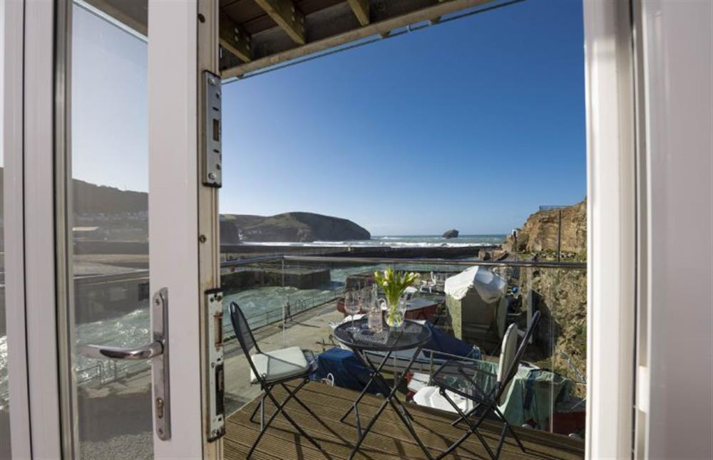 Bi-fold doors lead out to terraced balcony at Harbour Masters House, Portreath