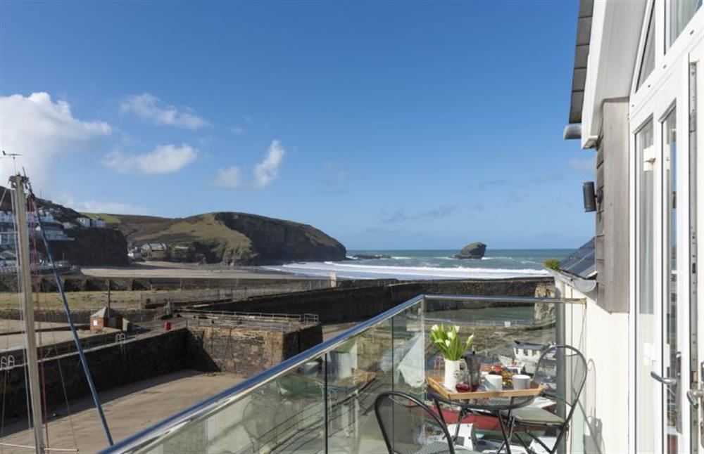 Master bedroom with side balcony overlooking the harbour (photo 2) at Harbour Masters House, Portreath