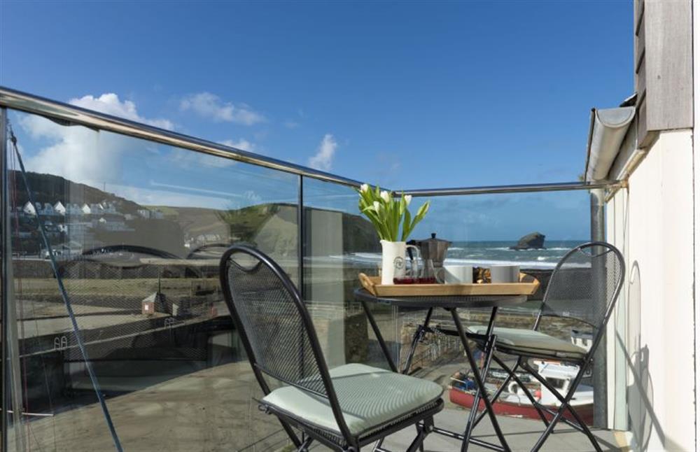 Master bedroom with side balcony overlooking the harbour at Harbour Masters House, Portreath