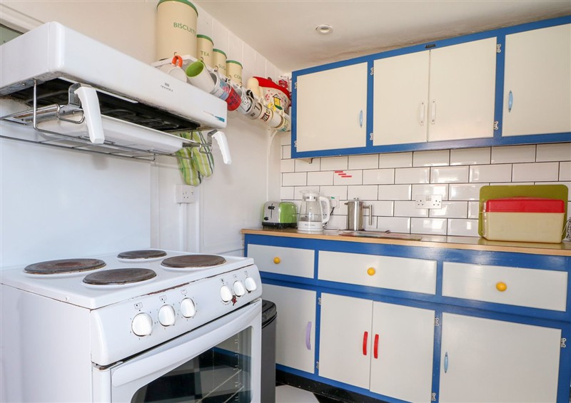 This is the kitchen at Harbour Road Quirky Beach Railway Carriages, Pagham