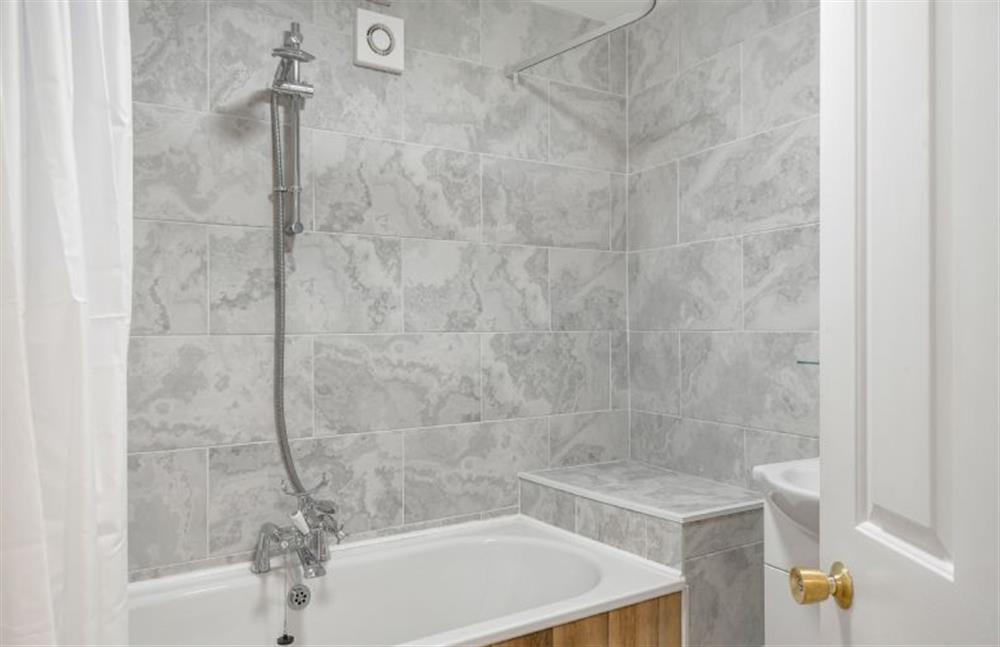 Bathroom comes equipped with bath and overhead shower, heated towel rail, wash basin and WC at Harbour Steps, Falmouth