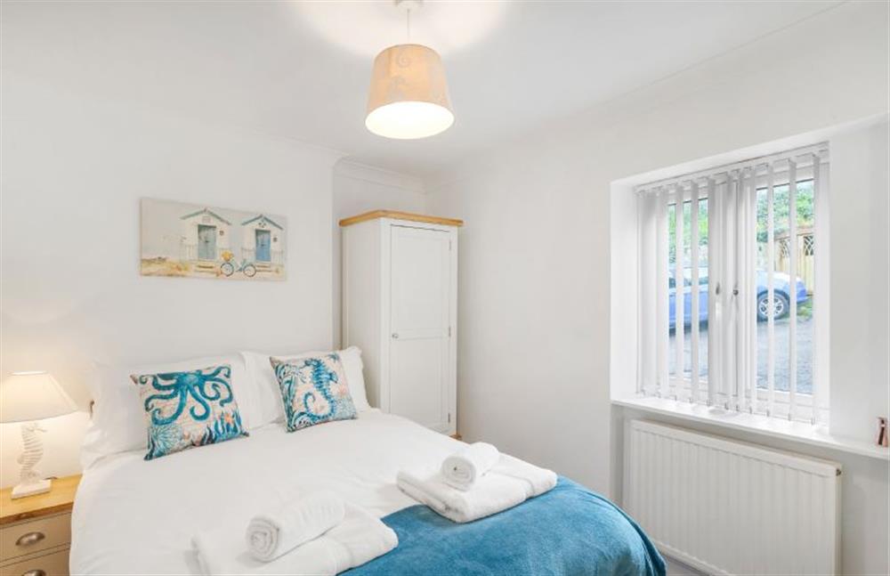 With double bed, bedside tables, wardrobe and dressing table at Harbour Steps, Falmouth