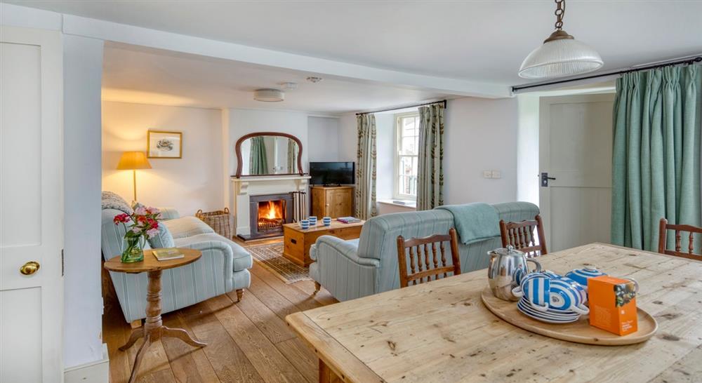 The sitting room and dining area at Harbour View in Boscastle, Cornwall
