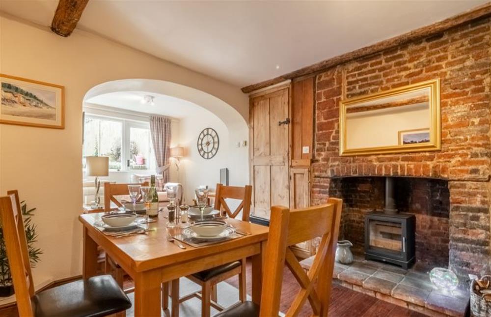 Harbour View Cottage: Dining area with a log burner \u0026 traditional fireplace at Harbour View Cottage, Wells-next-the-Sea