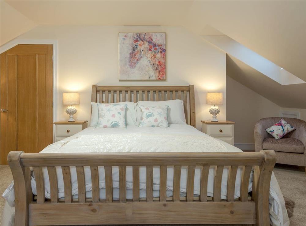 Attractive bedroom with kingsize bed and single bed at Harbour View in Wainfleet St. Mary, near Skegness, Lincolnshire