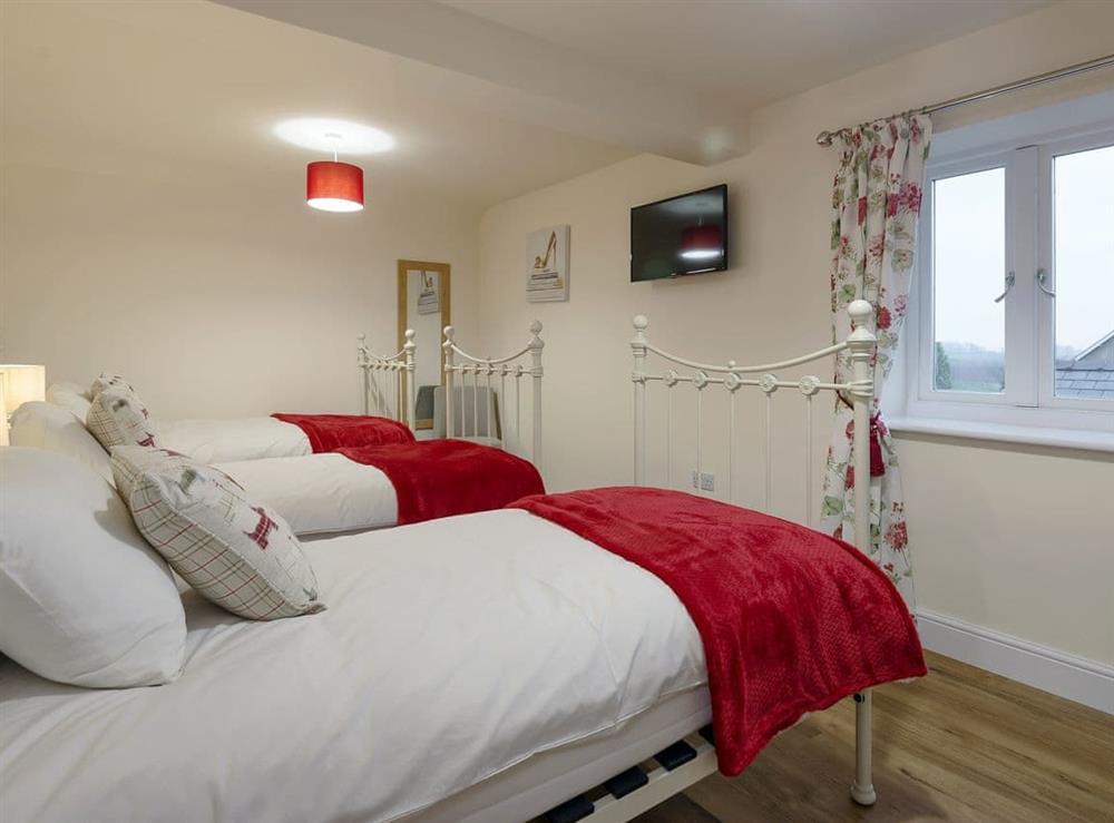 Triple bedroom with three single beds at Harbour View in Wainfleet St. Mary, near Skegness, Lincolnshire