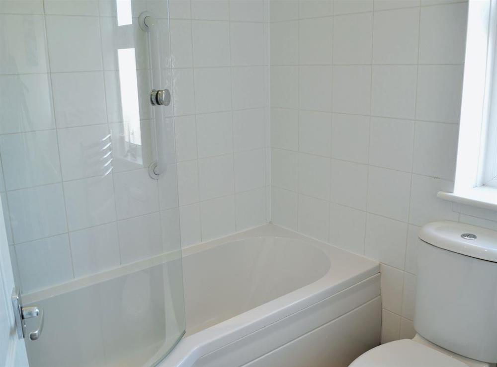 Bathroom with shower over bath at Harbour View in Whitby, North Yorkshire