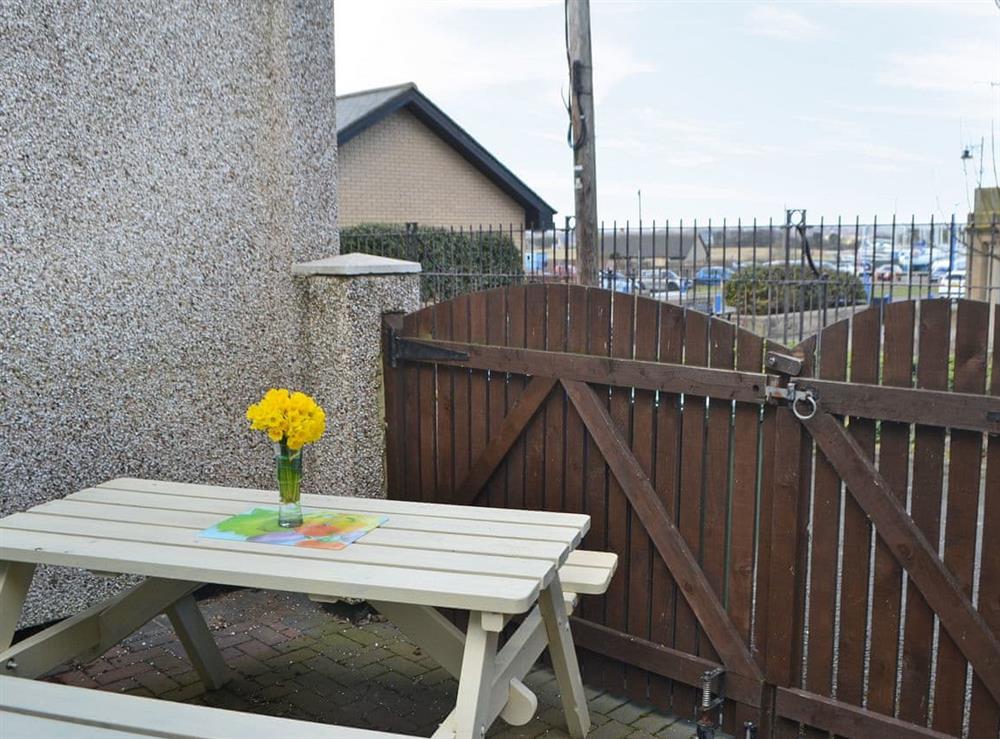 Secluded yard with sitting-out area at Harbour Walk in Amble, near Warkworth, Northumberland
