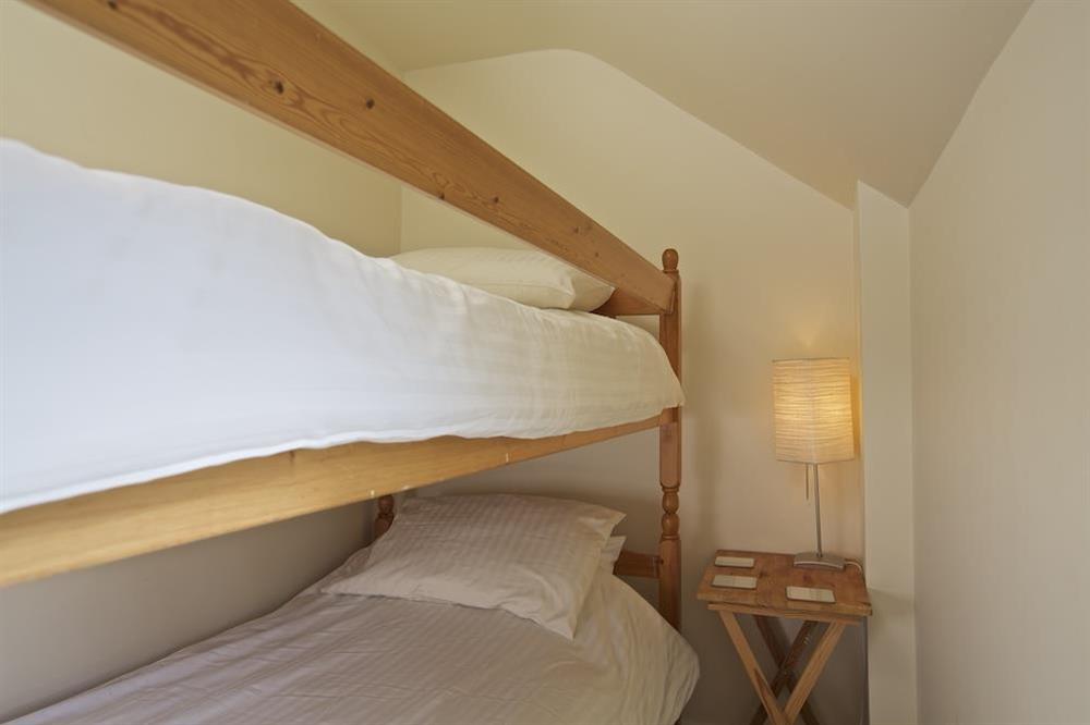 Second floor bedroom with full-size bunk beds and additional 3' single bed (photo 3) at Harbourfield in Herbert Road, Salcombe