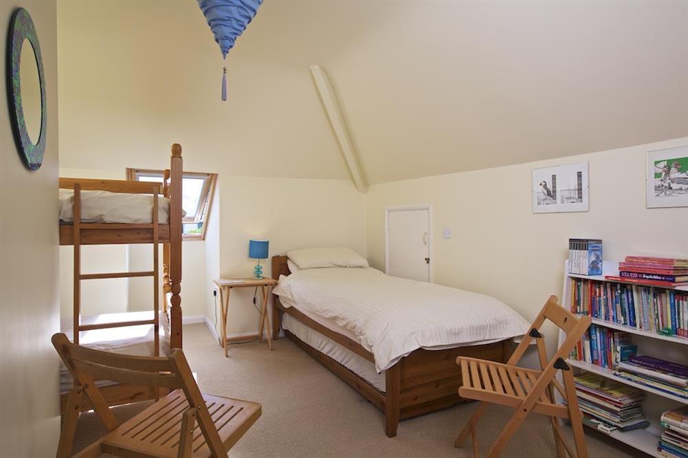 Second floor bedroom with full-size bunk beds and additional 3' single bed at Harbourfield in Herbert Road, Salcombe