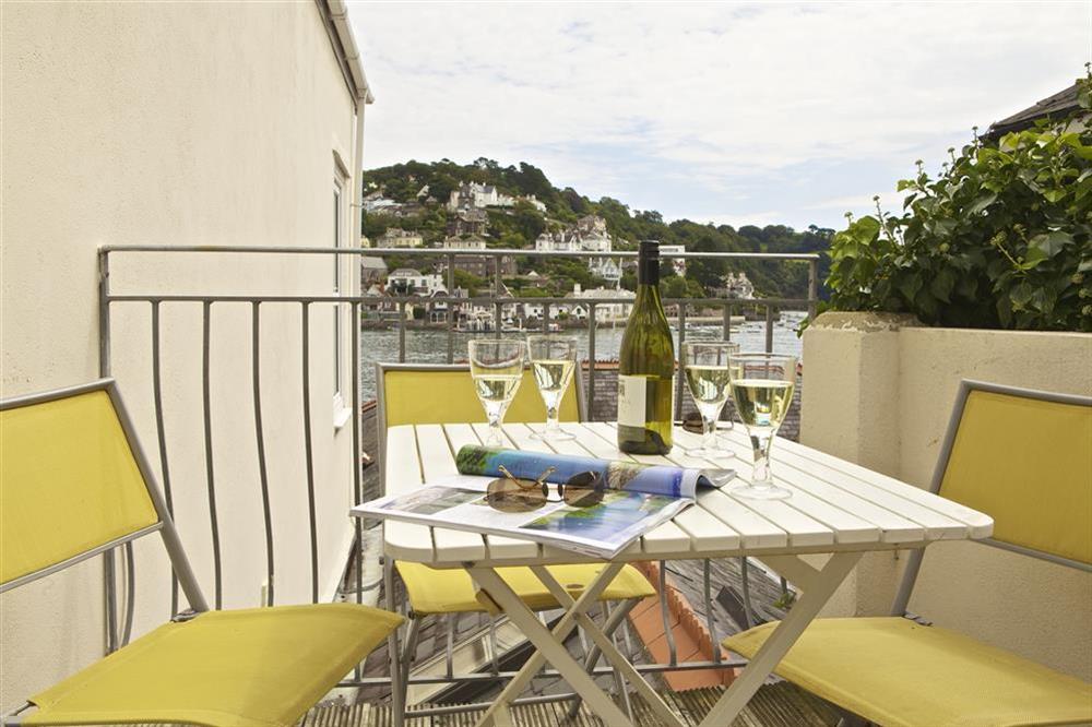 Sun terrace off the kitchen with patio furniture and Southerly views at Harbourside in South Town, Dartmouth