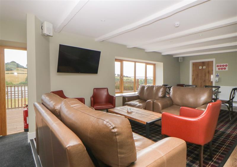 Relax in the living area at Harcombe House Bungalow 2, Chudleigh