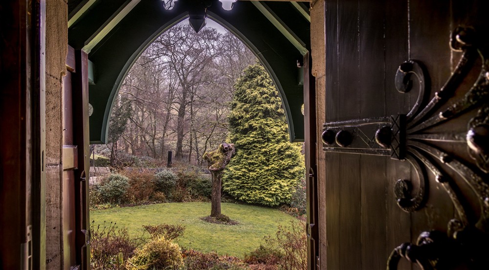 A view of the garden from the front door of Hardcastle Lodge, Yorkshire at Hardcastle Lodge in Hebden Bridge, West Yorkshire