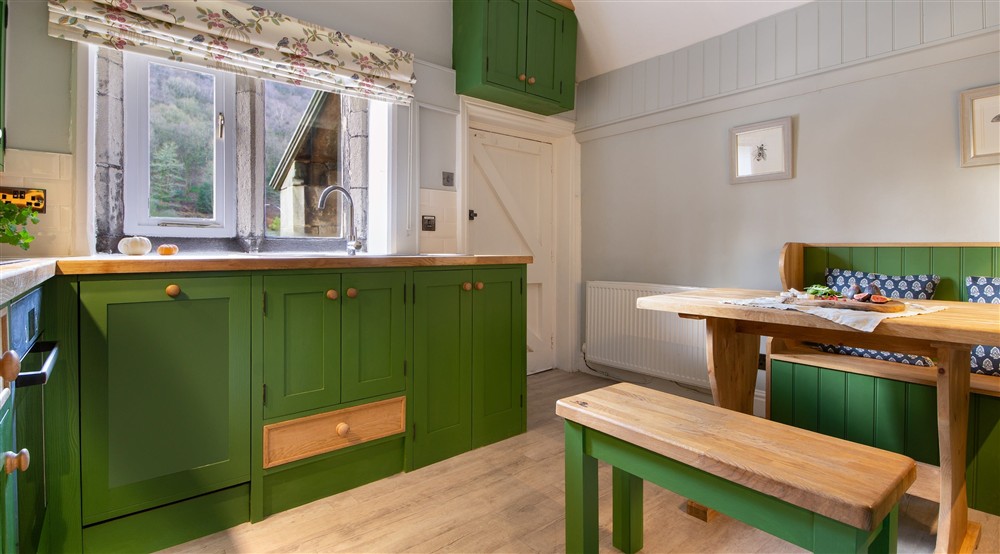 The kitchen with bench dining area at Hardcastle Lodge in Hebden Bridge, West Yorkshire