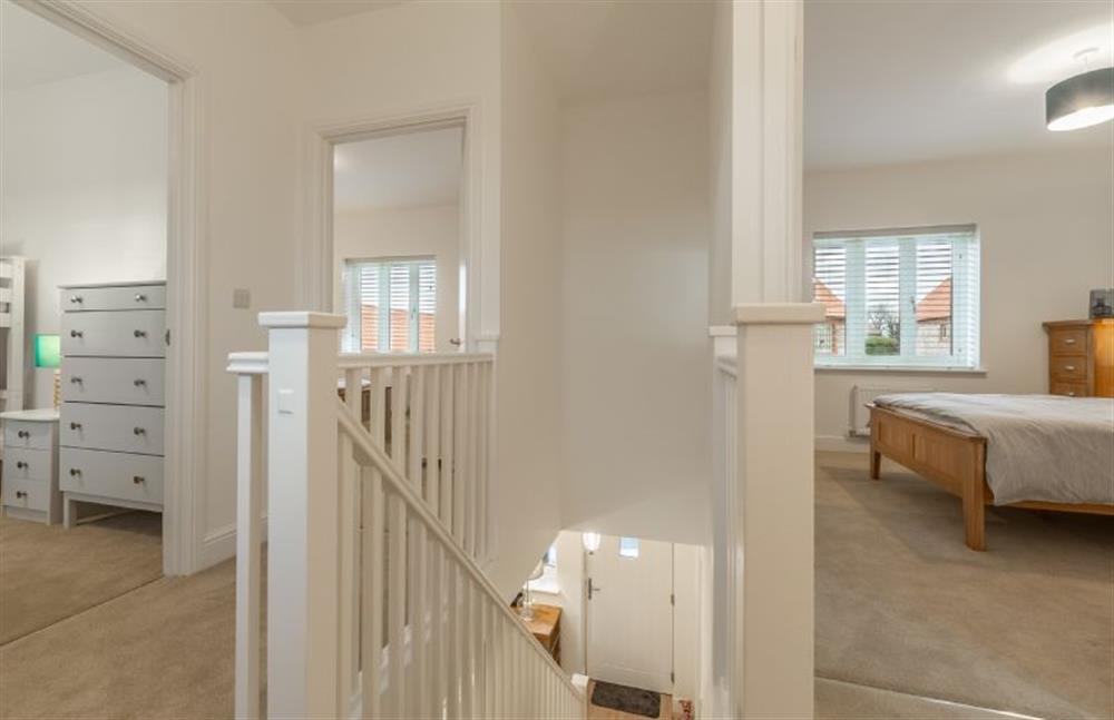 First floor: Landing with doors leading to bedrooms and family bathroom at Hare Cottage, Bodham near Holt