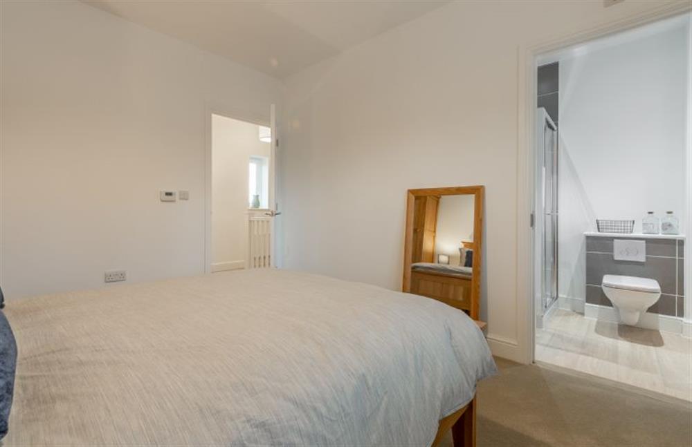 First floor: Master bedroom with an en-suite shower room at Hare Cottage, Bodham near Holt