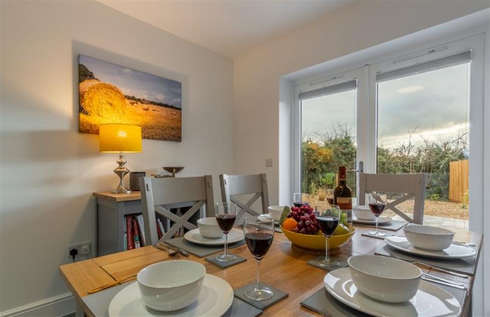 Ground floor: Dining table with seating for six at Hare Cottage, Bodham near Holt