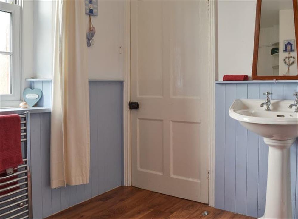 Bathroom with roll-top bath and separate shower (photo 2) at Harebeck Cottage in Gosforth, near Whitehaven, Cumbria