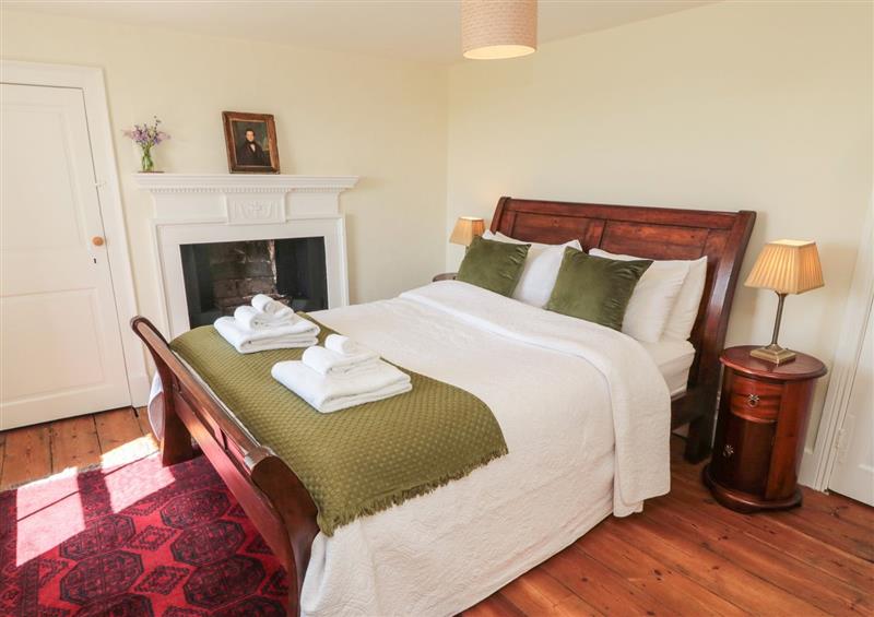A bedroom in Harnham Hall Cottage at Harnham Hall Cottage, Harnham near Ponteland