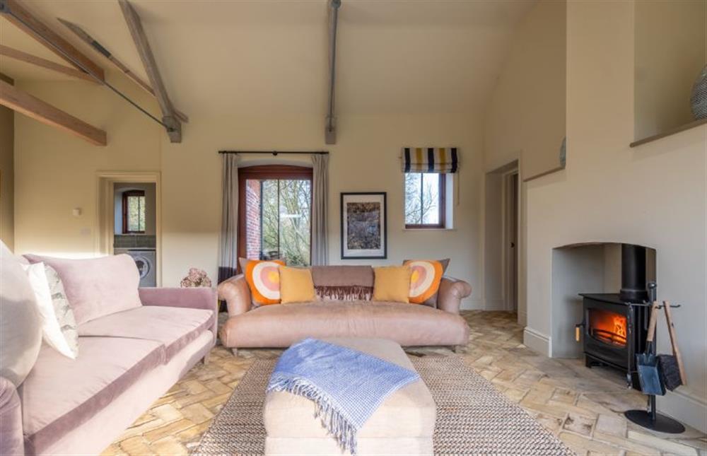 Light, bright sitting area with wood burning stove