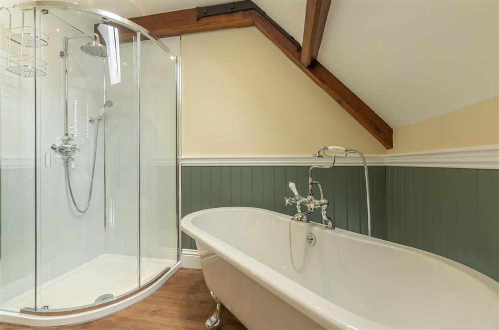 First floor: Luxurious en-suite bathroom to bedroom two featuring a roll-top bath at Harome Chapel, Harome, near Helmsley 