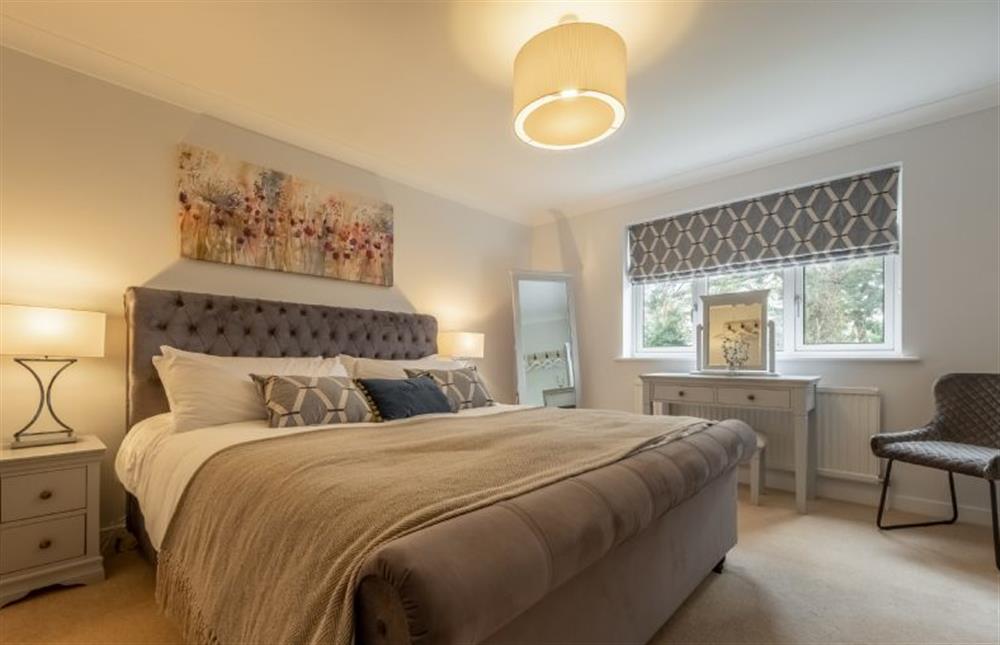First floor: Master bedroom with 5ft king-size bed at Harp Garden, Fakenham