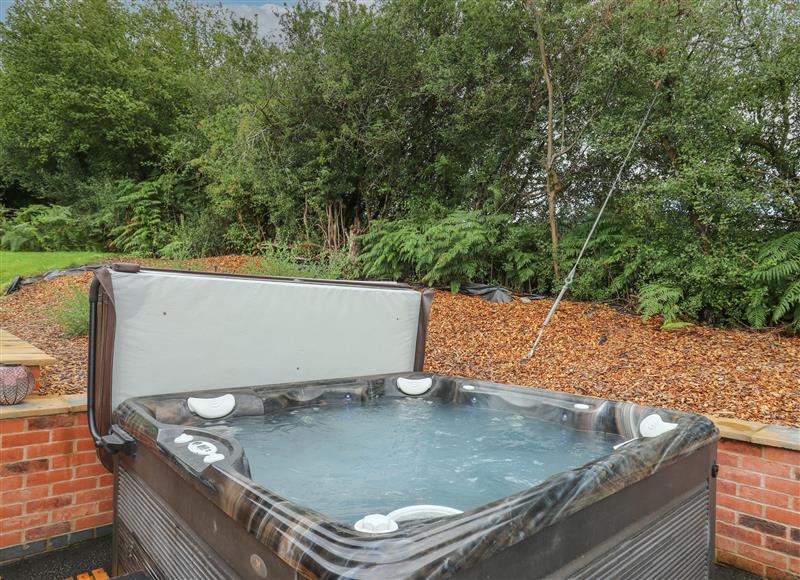 Relax in the hot tub at Harp Meadow, Presteigne
