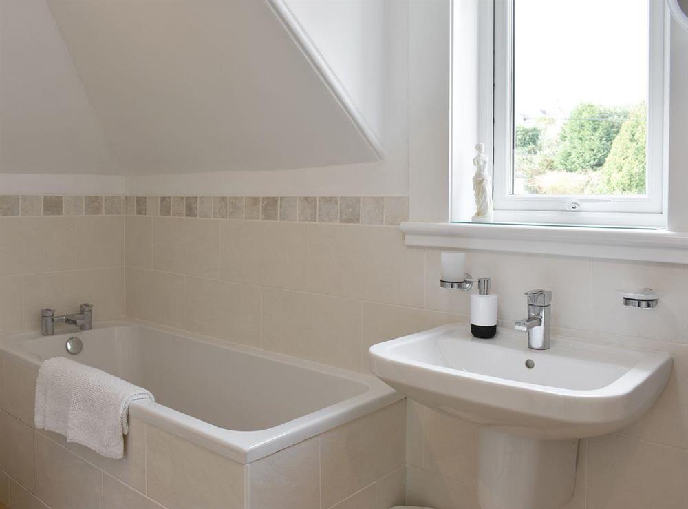 Family bathroom with bath and separate shower cubicle at Harport in Lamlash, Isle Of Arran