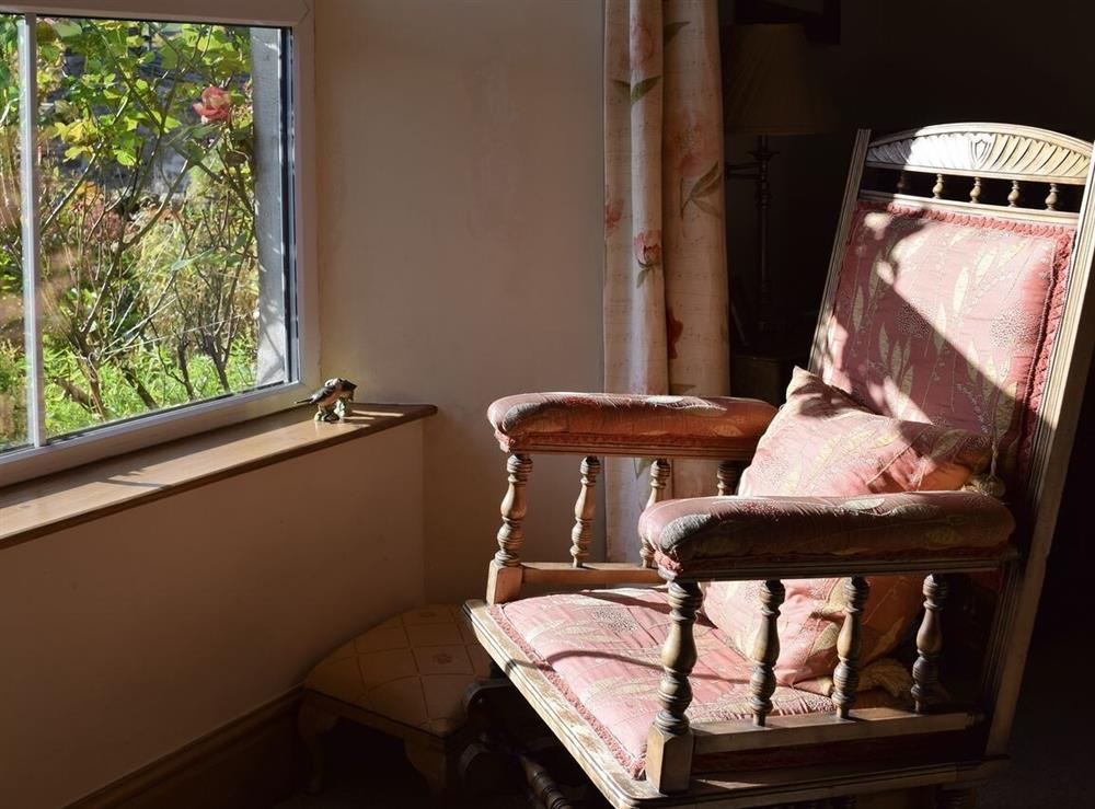 Seat in living room overlooking garden at Harriet’s Cottage in Richmond, North Yorkshire
