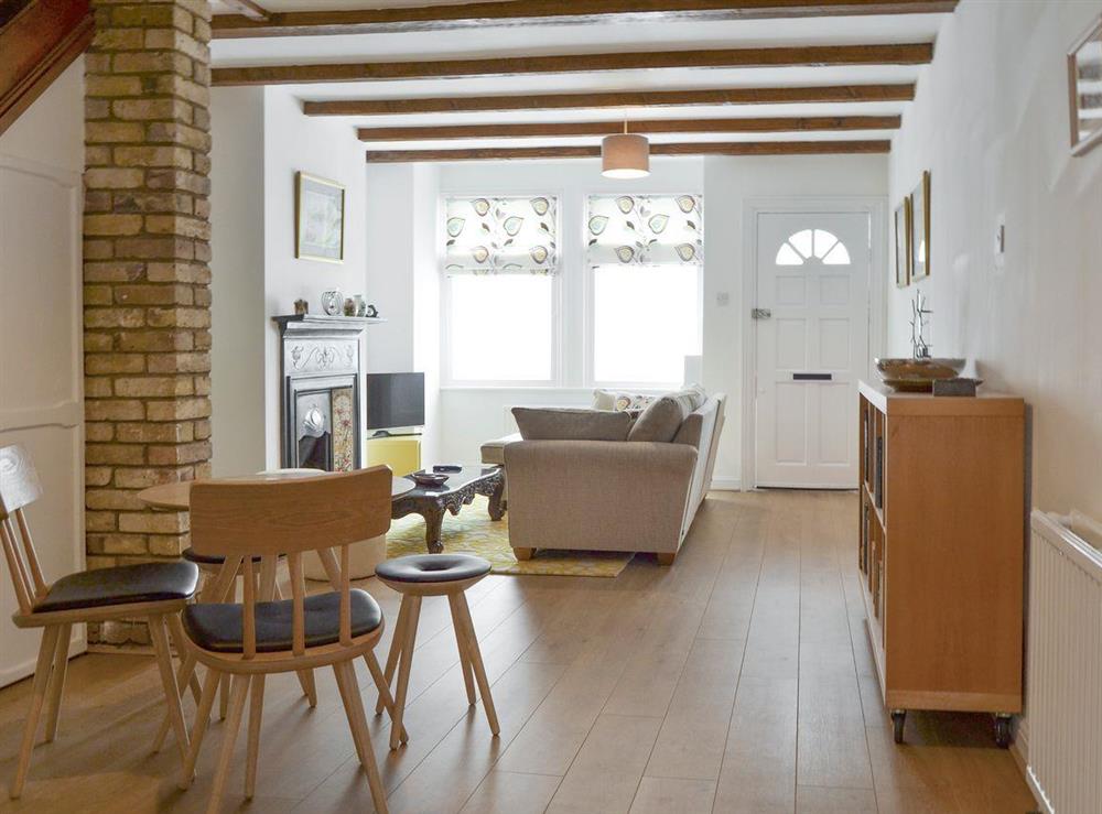 Informal dining area within living room at Harrison Barber Cottage in Colnbrook, near Windsor, Berkshire