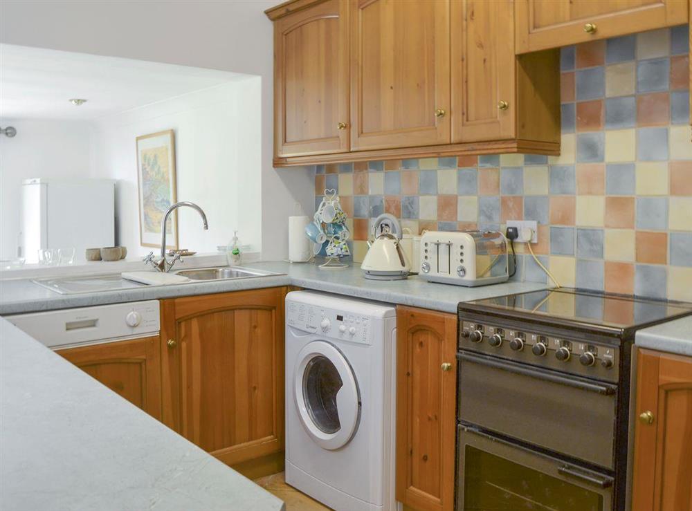Well-equipped fitted kitchen at Harrison Barber Cottage in Colnbrook, near Windsor, Berkshire