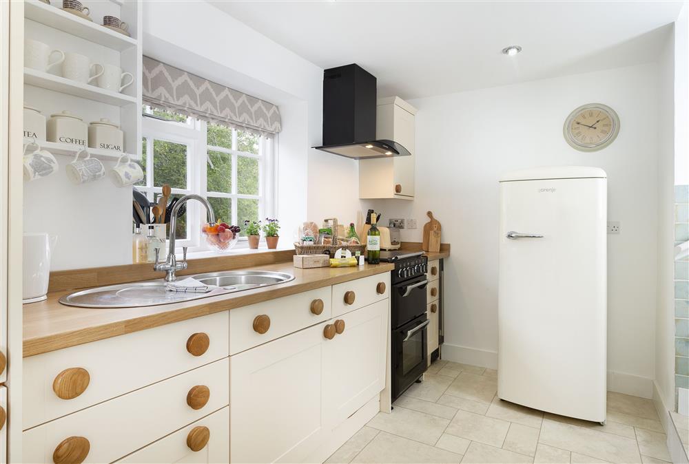 Ground floor: Kitchen with two steps up to sitting room at Harrowby End, Ebrington, near Chipping Campden