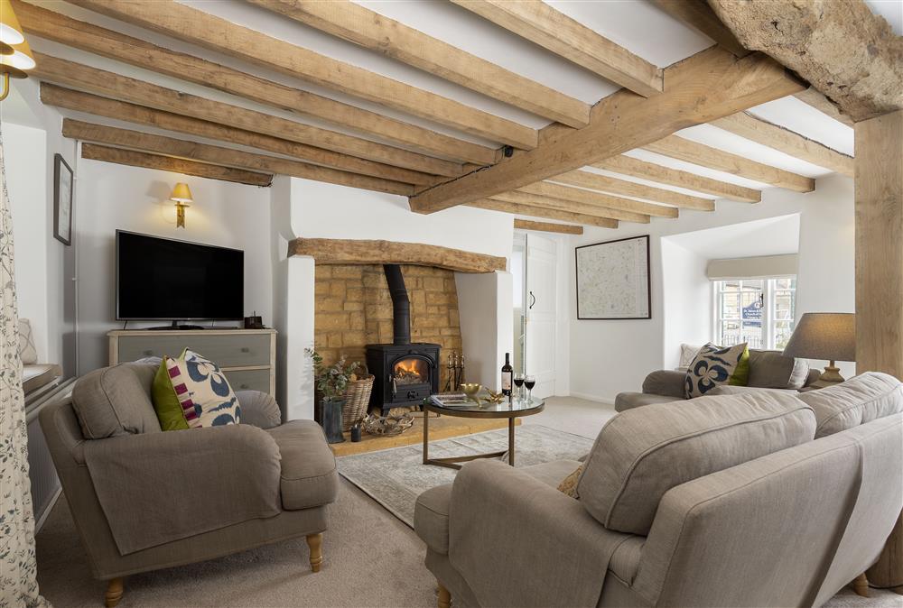 Ground floor: Large sitting room and dining area with inglenook fireplace and window seats at Harrowby End, Ebrington, near Chipping Campden