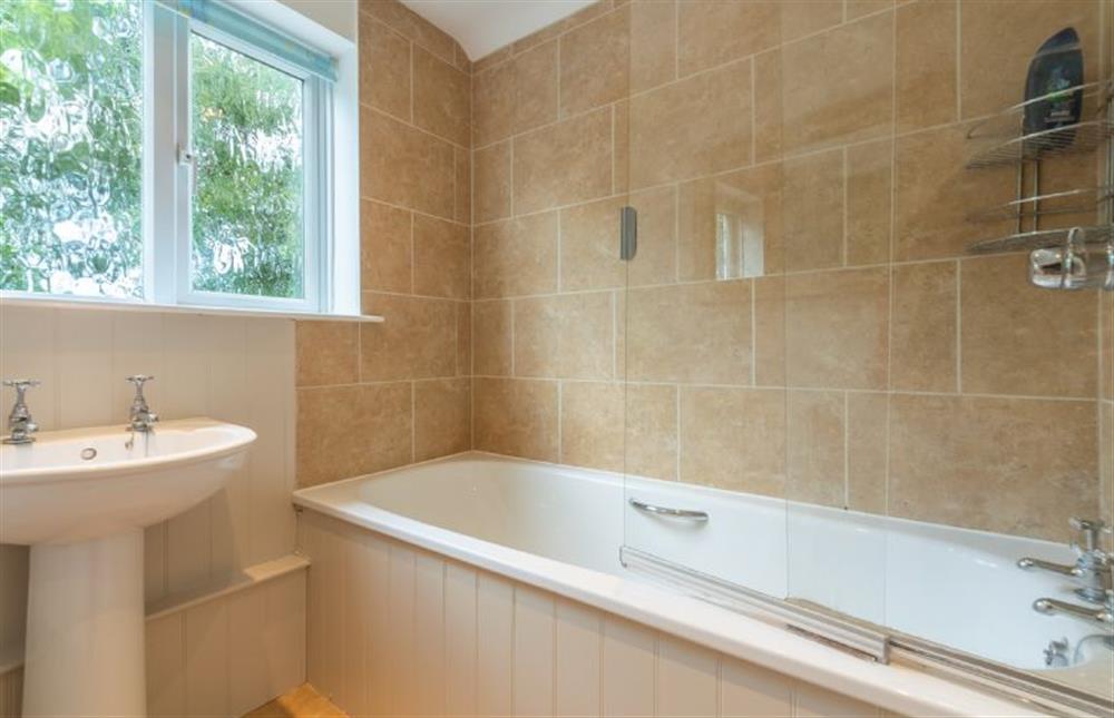 First floor: Bathroom with shower over the bath at Harts House, Burnham Overy Staithe near Kings Lynn