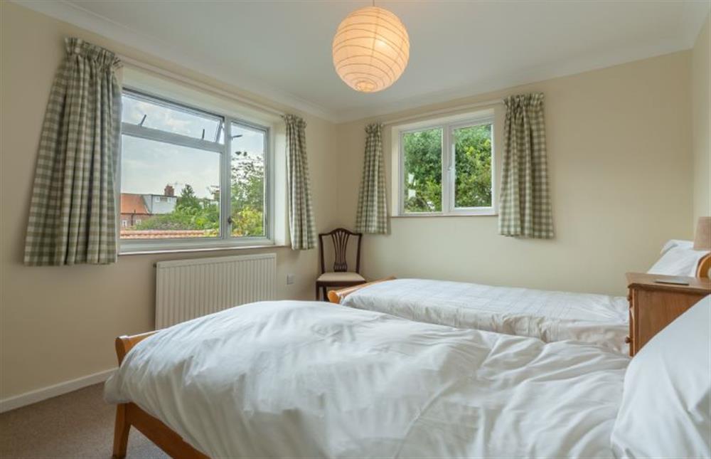 First floor: Bedroom three with two full-size single beds at Harts House, Burnham Overy Staithe near Kings Lynn