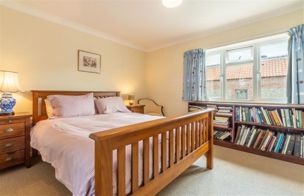 First floor: Bedroom two with views down to the harbour at Harts House, Burnham Overy Staithe near Kings Lynn