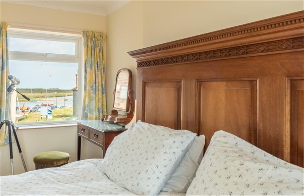 First floor: Master bedroom offers views of the harbour and sea beyond at Harts House, Burnham Overy Staithe near Kings Lynn