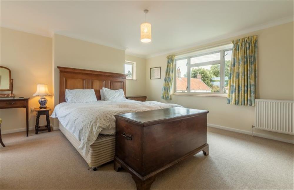 First floor: Master bedroom with king-size bed at Harts House, Burnham Overy Staithe near Kings Lynn