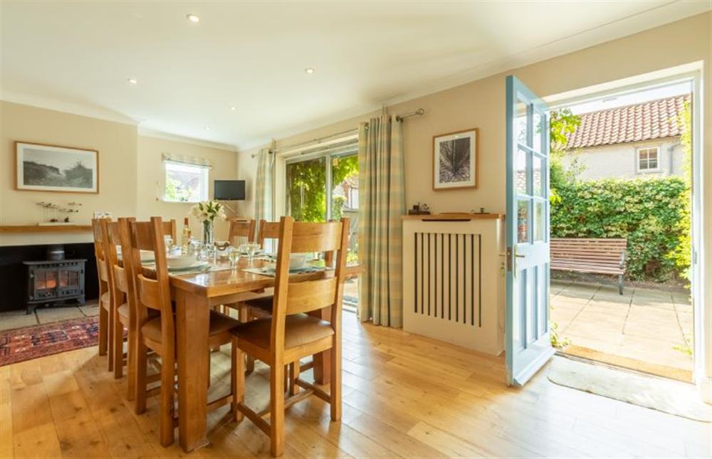 Ground floor: Dining area with cosy wood burning stove at Harts House, Burnham Overy Staithe near Kings Lynn